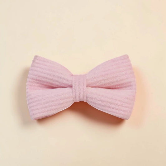 Pink dog bow on a beige background