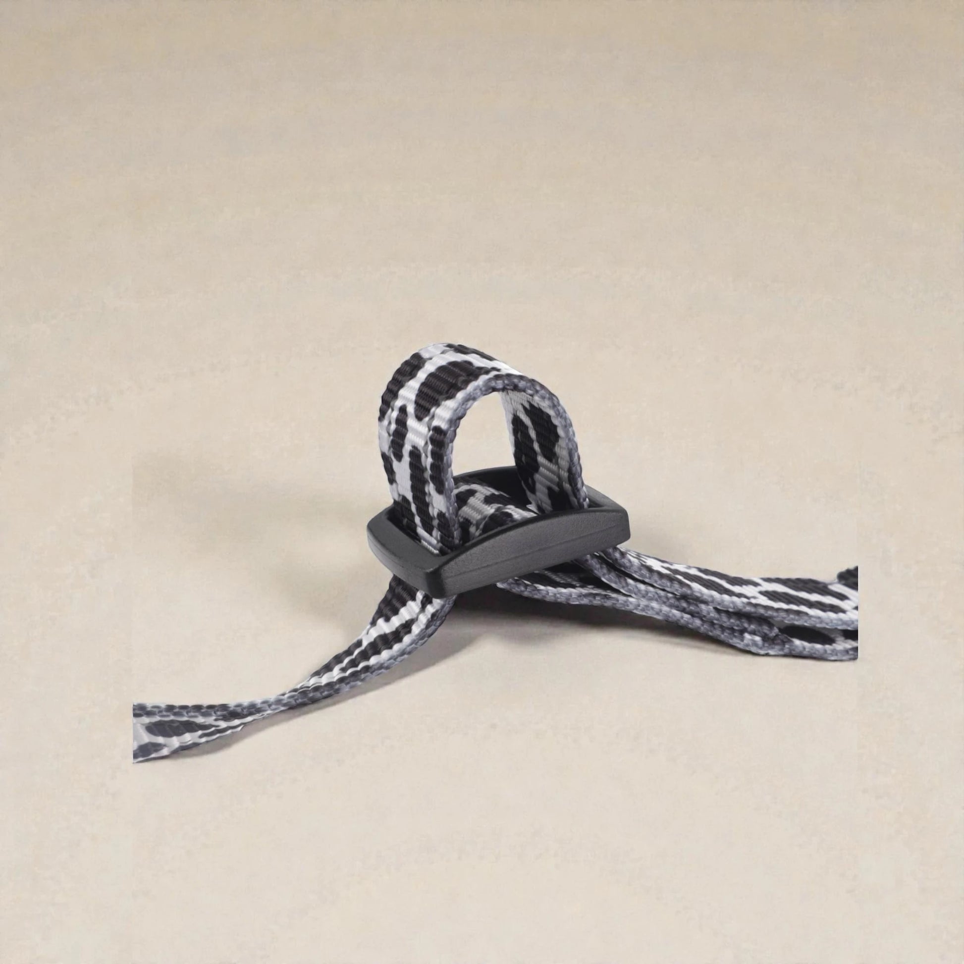 adjuster on step in dog harness on a beige background