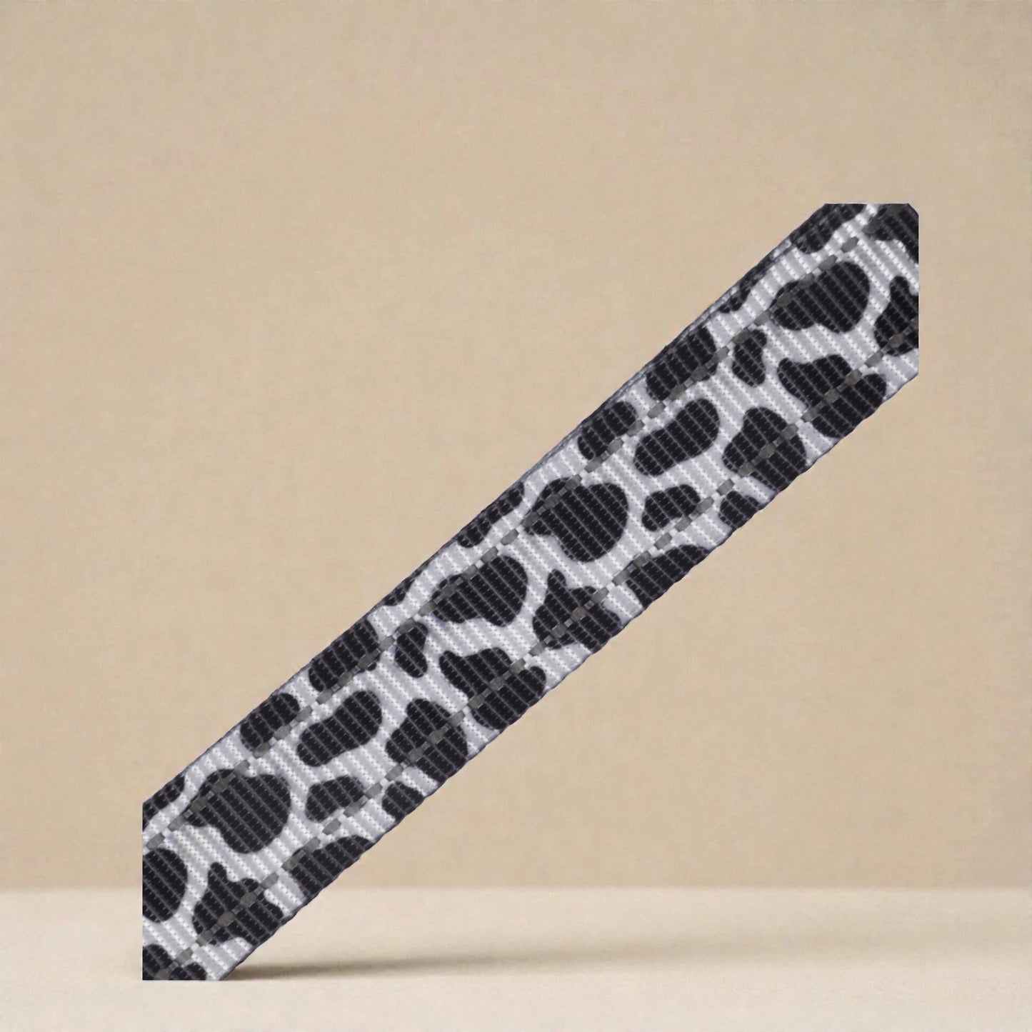 Cow print harness pattern a beige background