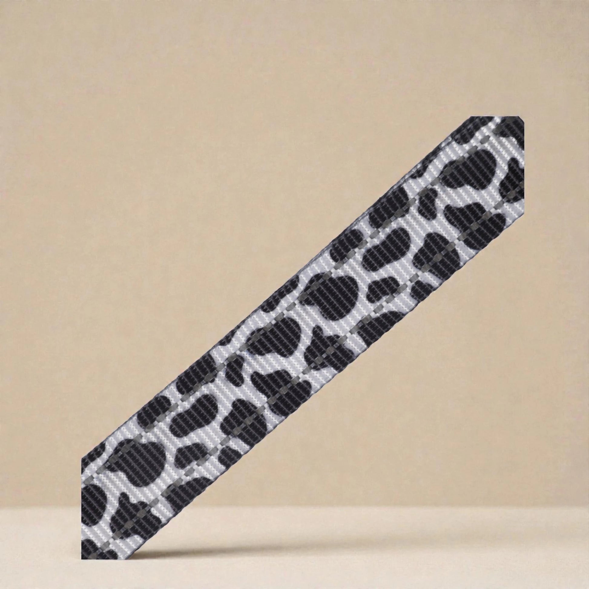 Cow print harness pattern a beige background