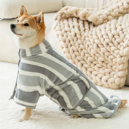 Dog in grey and white striped fleece drying robe, cozy design for quick drying.