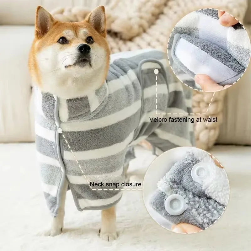 Medium to large dog wearing a striped fleece drying robe with Velcro fastening and neck snap closure.