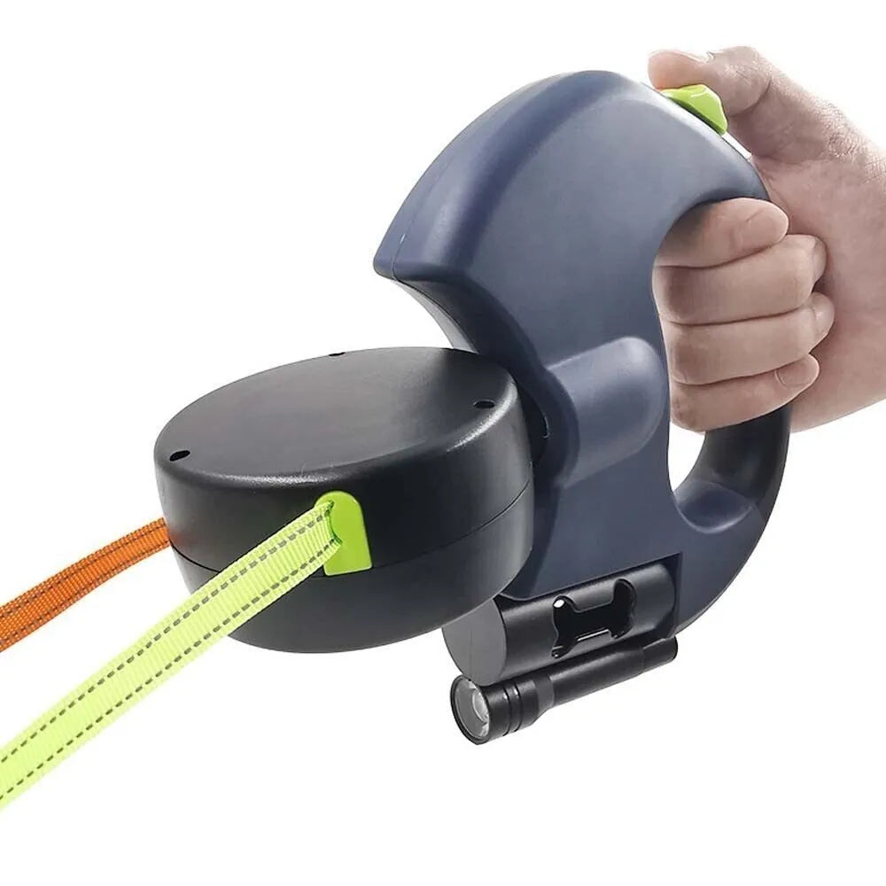 Retractable dog lead with flashlight held by a hand on a white background