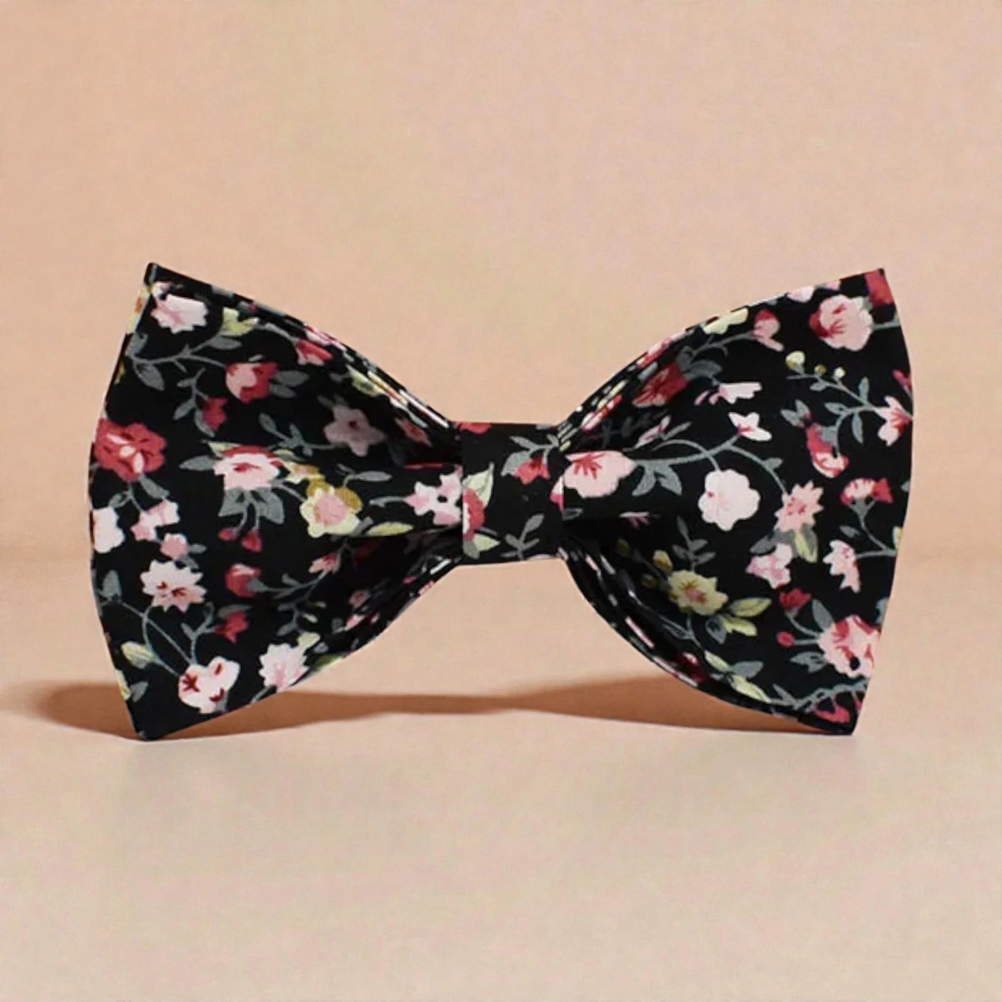 Floral patterned bow tie on a beige background