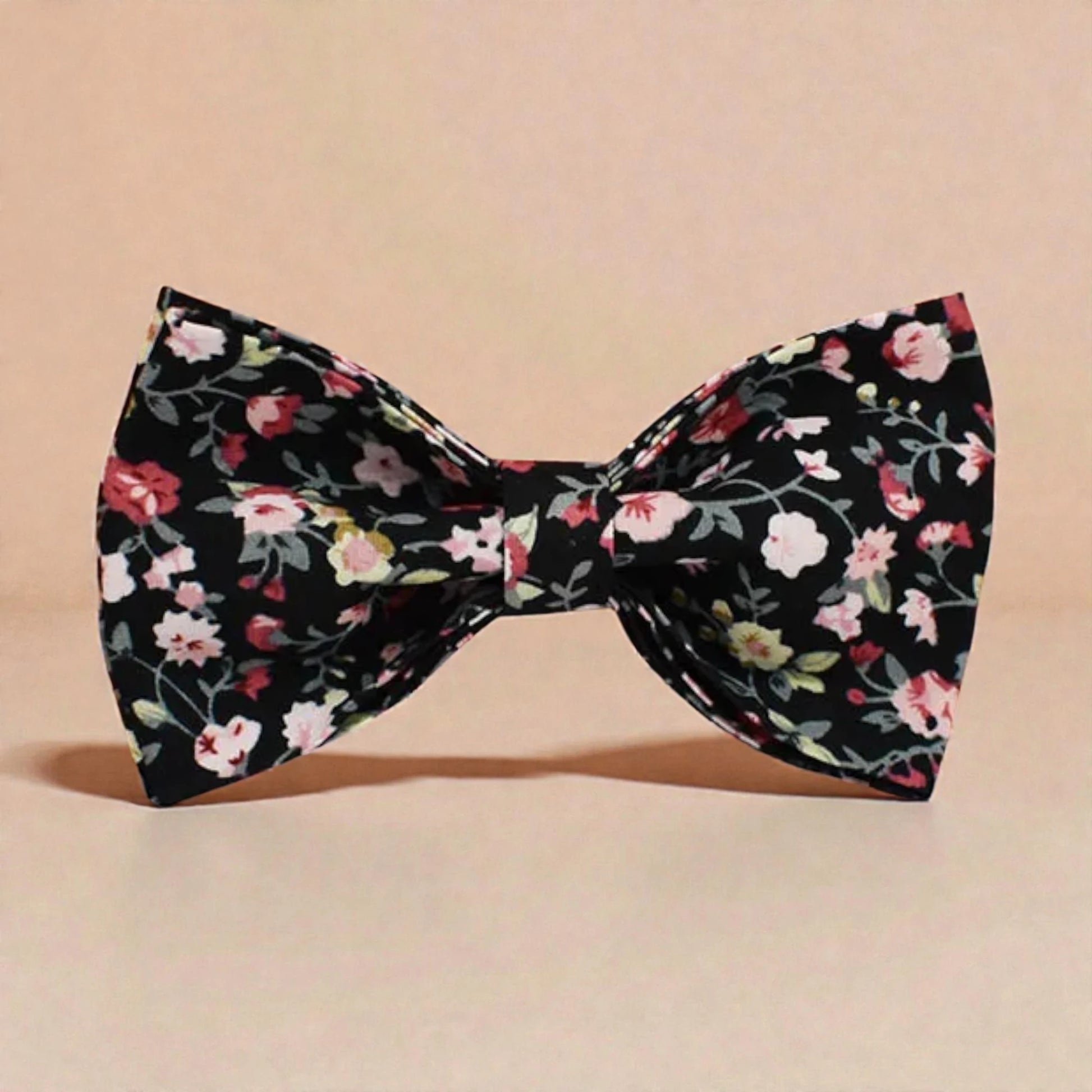 Floral patterned bow tie on a beige background