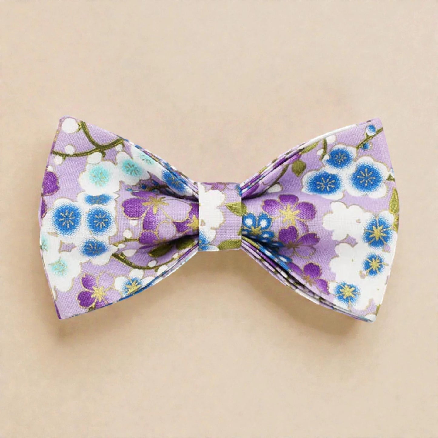 Floral patterned bow tie on a beige background