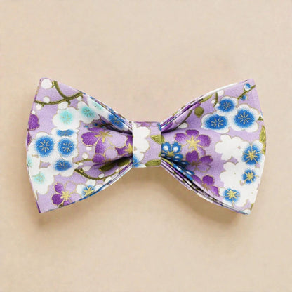 Floral patterned bow tie on a beige background