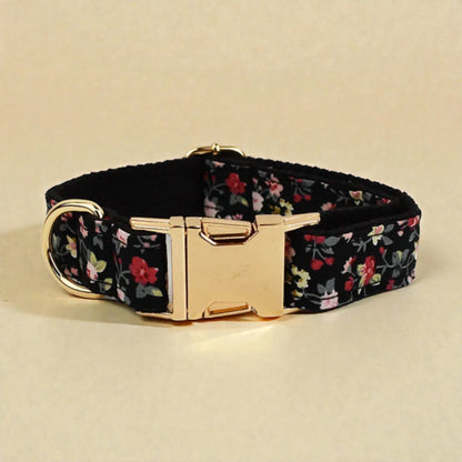 Floral-patterned dog collar with a gold buckle on a beige background