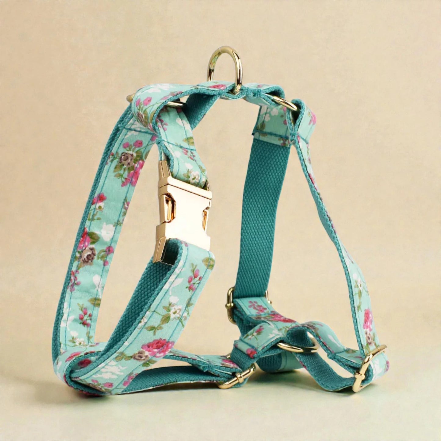 Floral-patterned dog harness on a beige background