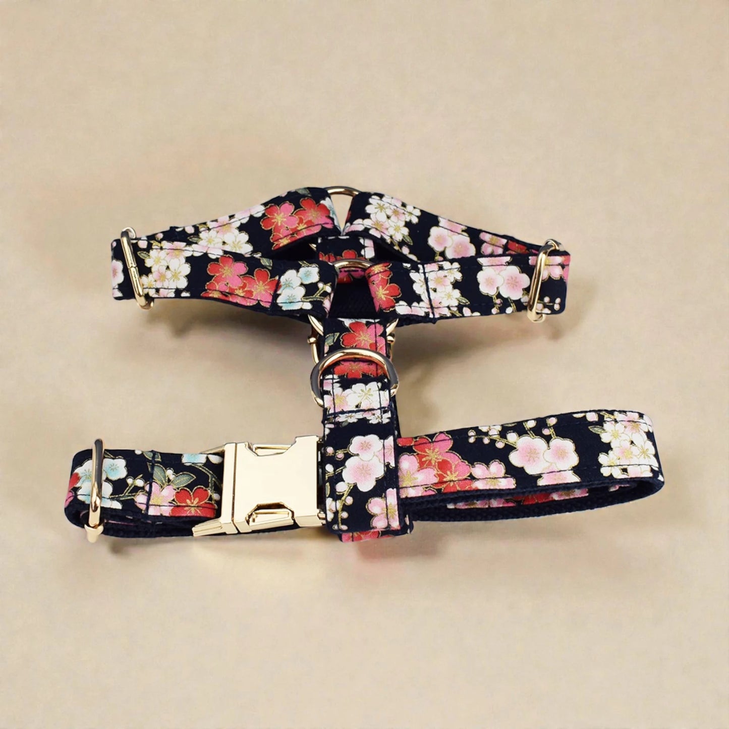 Floral patterned dog harness on a beige background