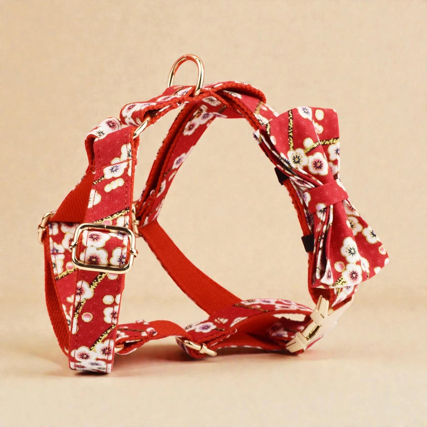 Red floral dog harness on a beige background