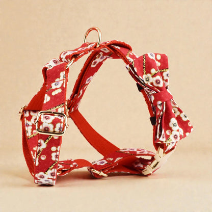 Red floral dog harness on a beige background