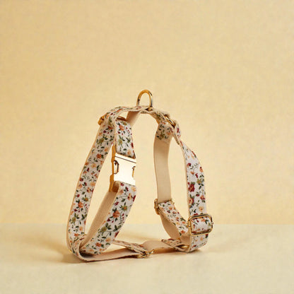 Floral-patterned dog harness on a beige background