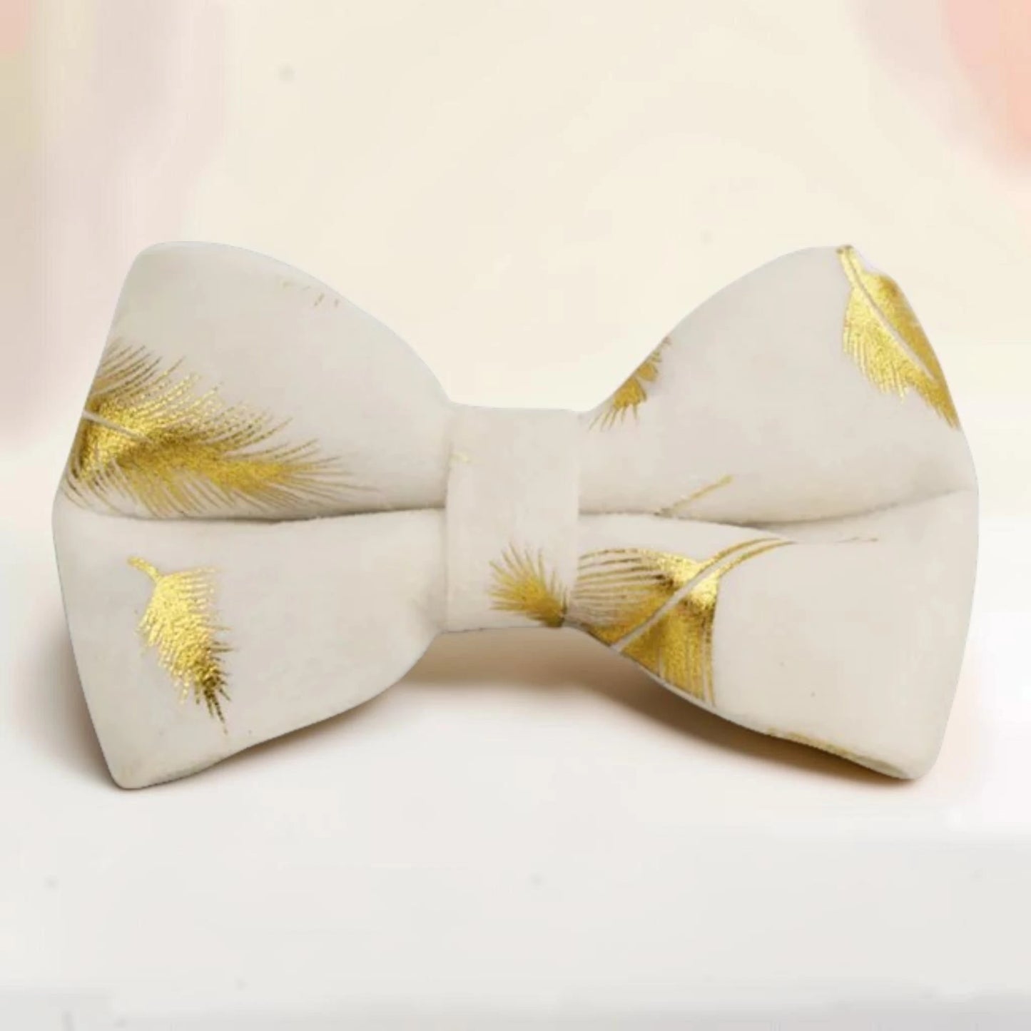 A golden feather detachable dog bow tie