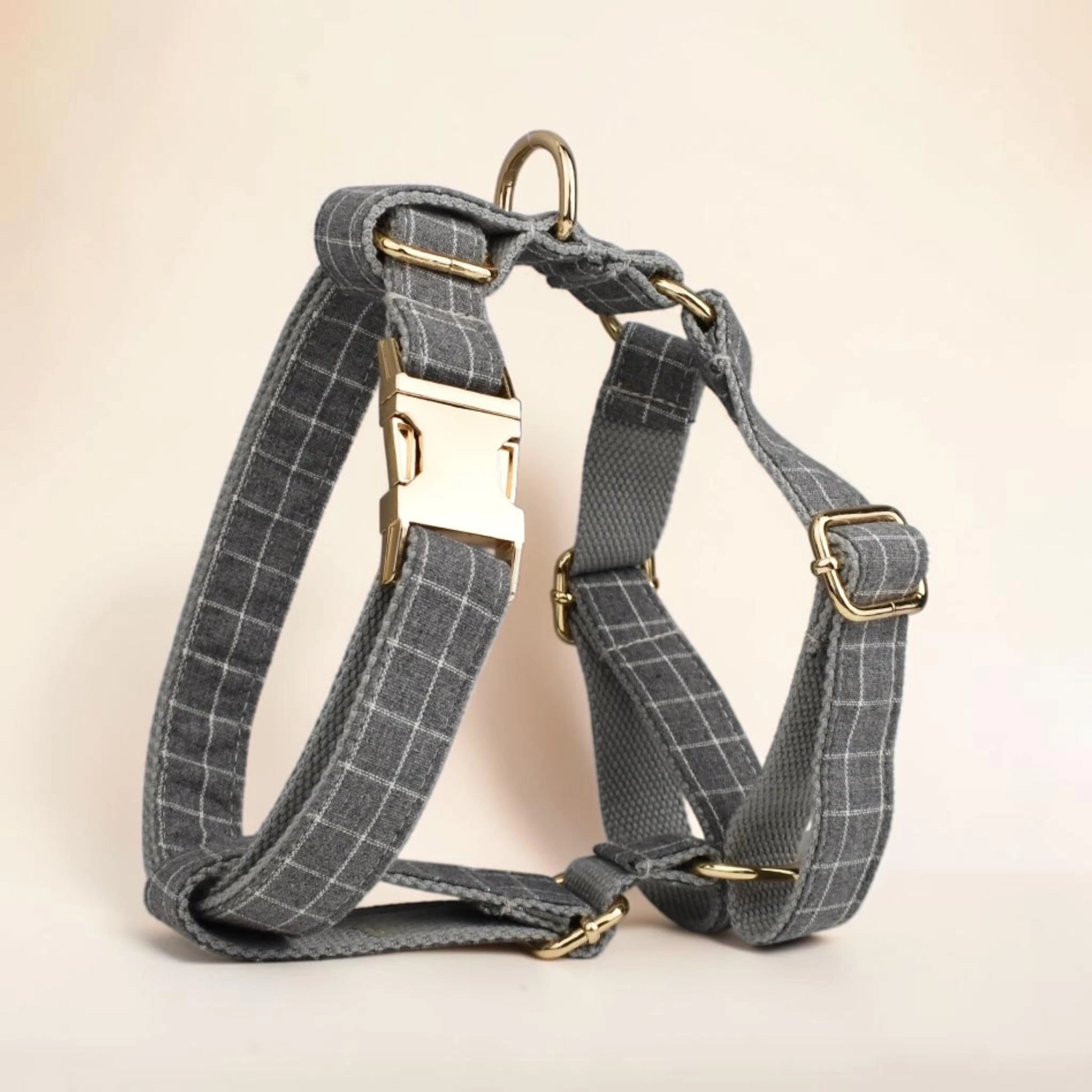 Grey check dog harness with gold buckle
