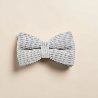 Grey dog bow tie on a beige background
