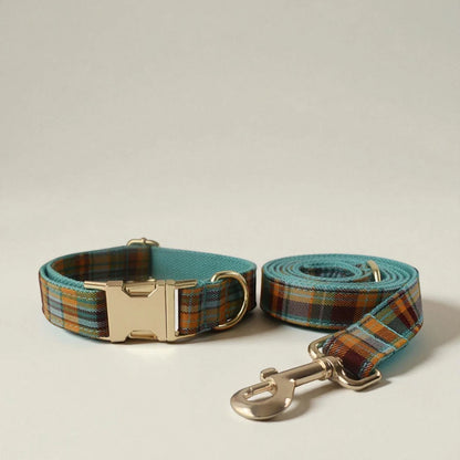 Plaid dog collar and leash set on a beige background