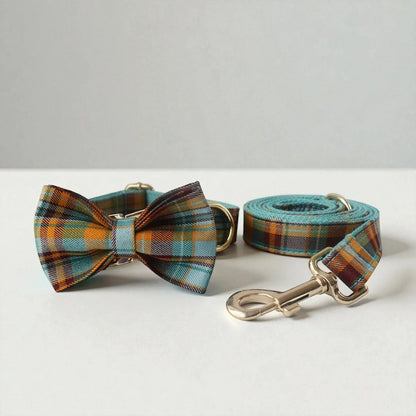 Plaid dog collar with bow tie and matching leash on a white background