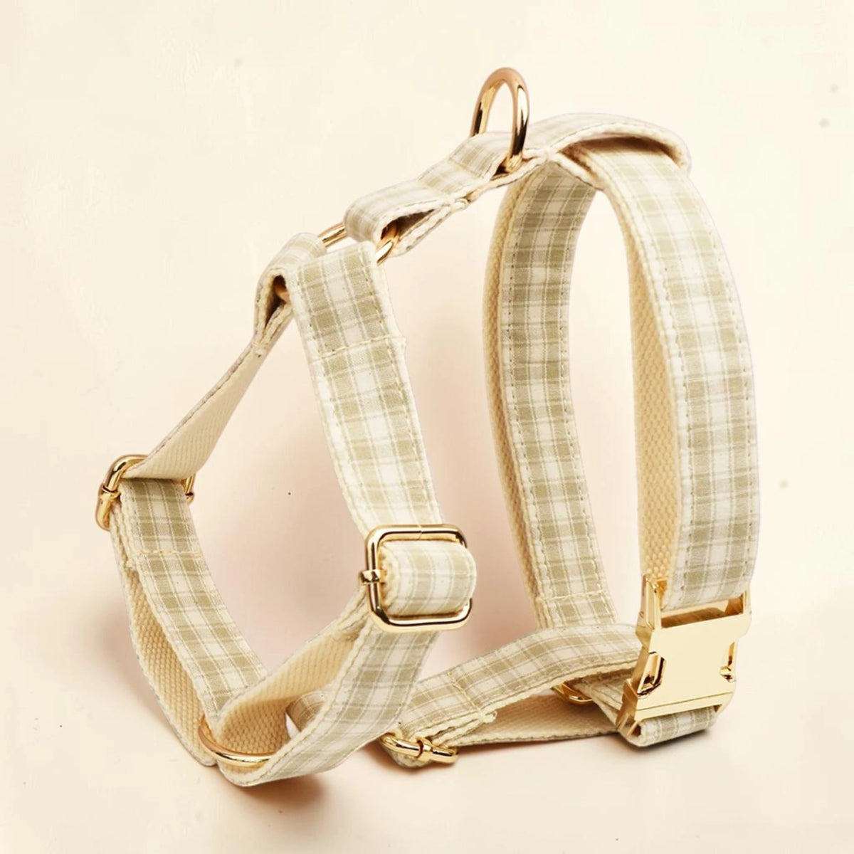 Beige heritage check dog harness with a  gold buckle.