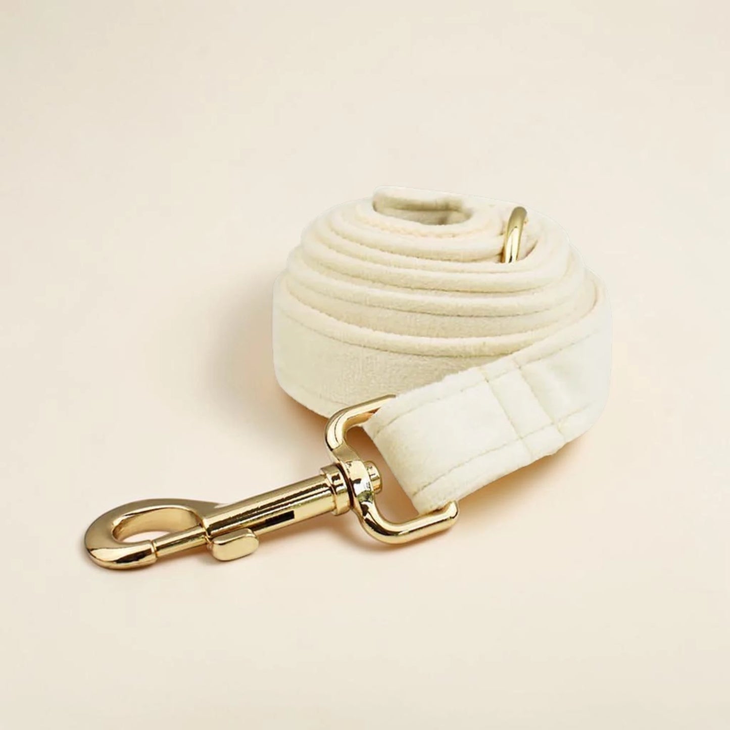 Ivory wedding dog lead with gold clip on a beige background