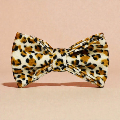 Leopard print bow tie on a beige background