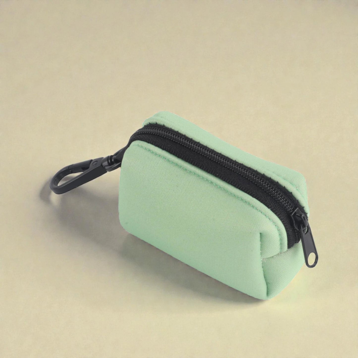 green poop bag holder with clip and a zip