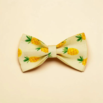 Bow tie with pineapple pattern on a beige background
