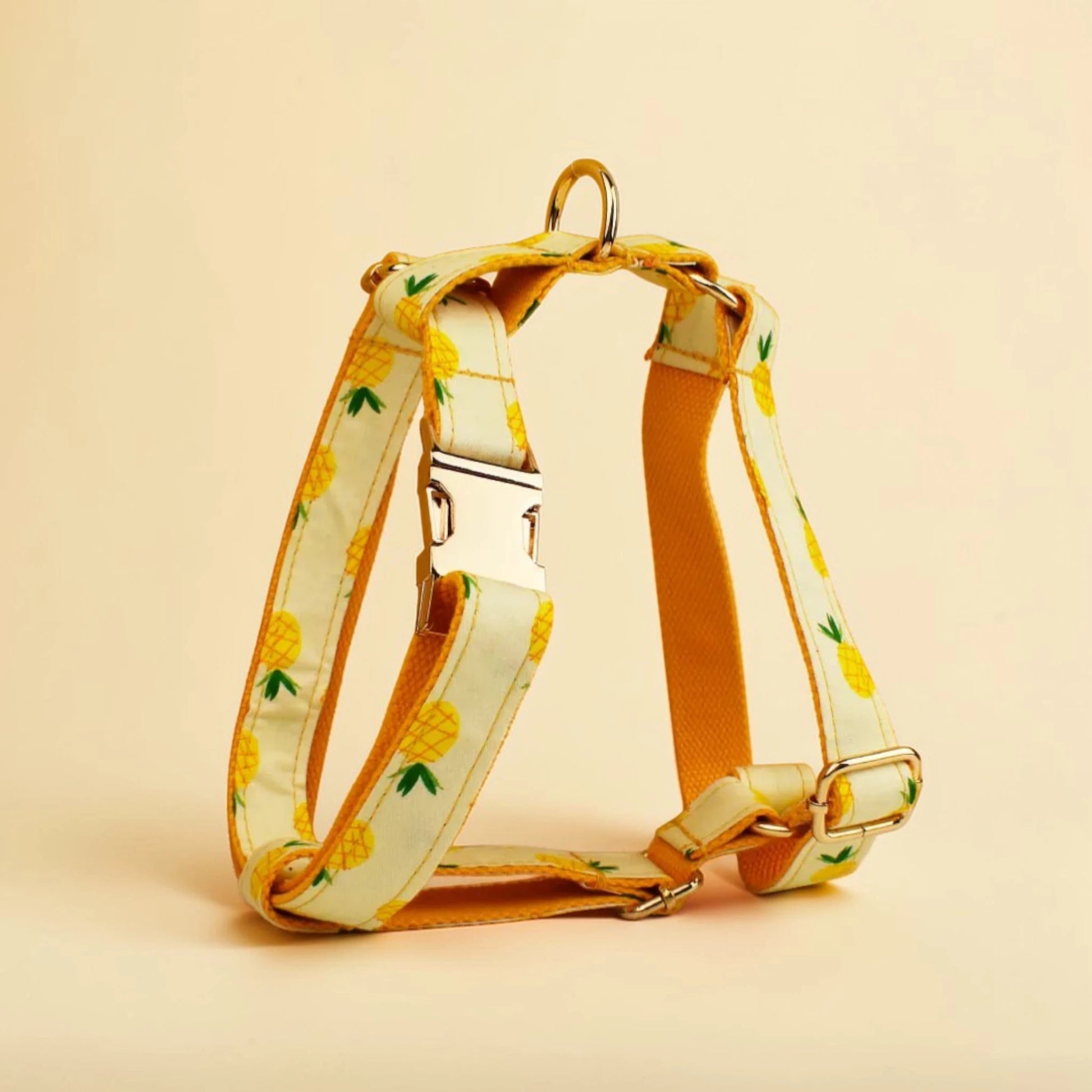 Dog harness with pineapple pattern on a beige background