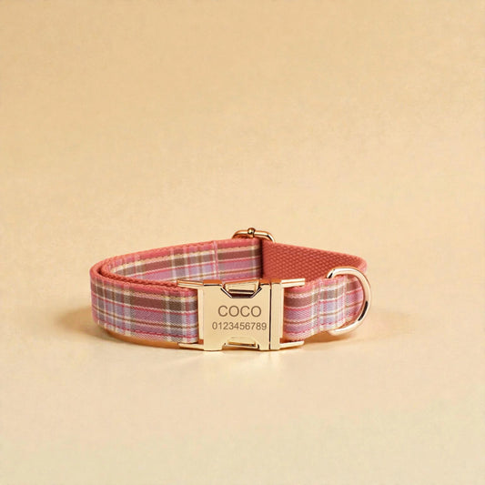 Pink plaid dog collar with a gold personalised buckle on a beige background
