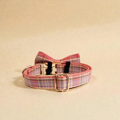 Pink plaid adjustable dog collar on a beige background