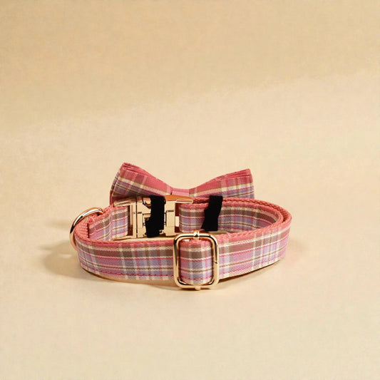 Pink plaid adjustable dog collar on a beige background