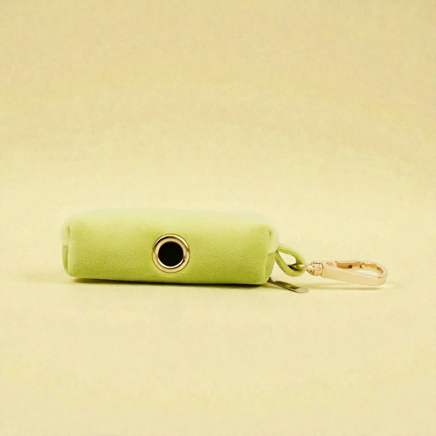 green dog poop bag holder with clip and a zip