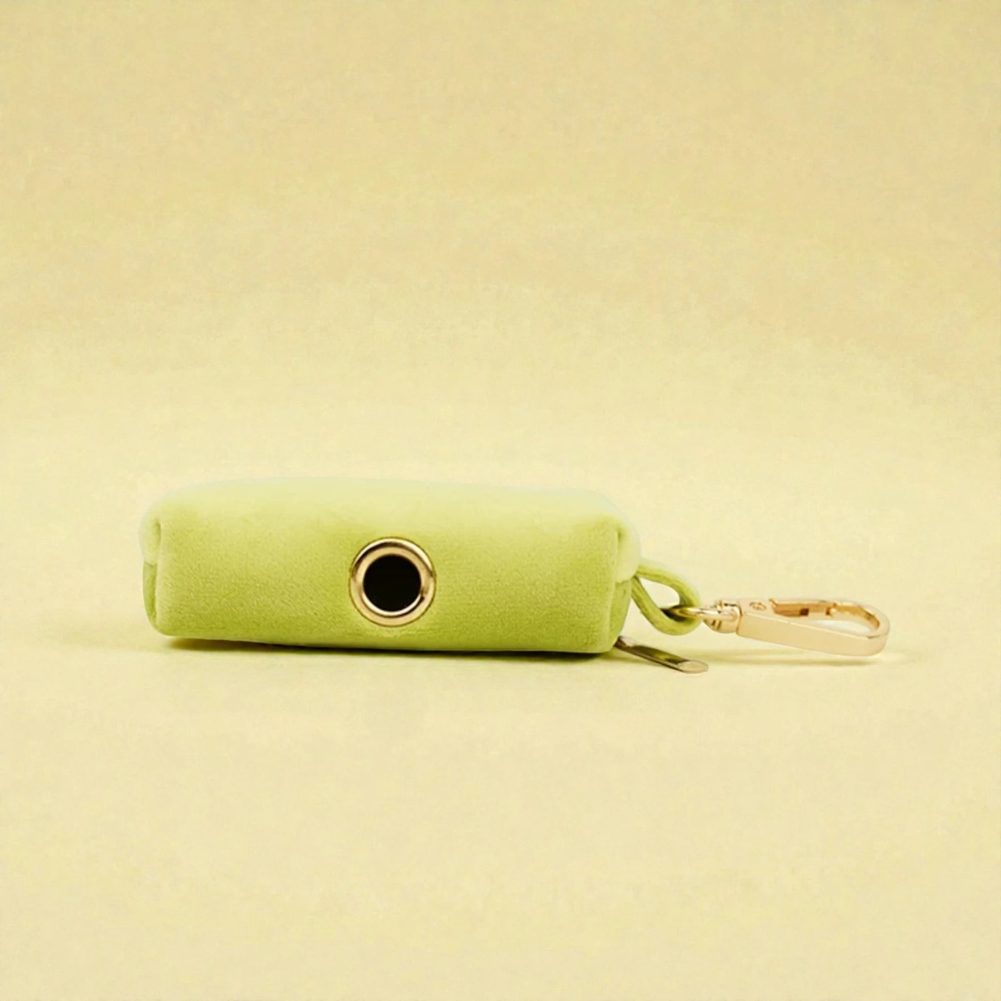 green dog poop bag holder with clip and a zip