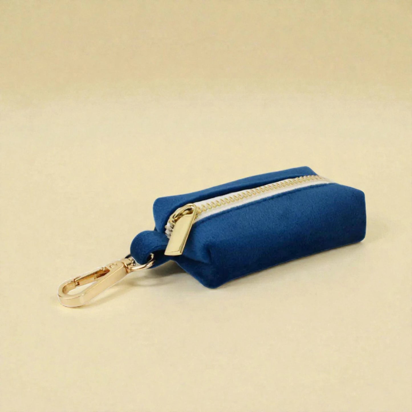 Blue velvet dog poop bag holder with gold zip and gold clip