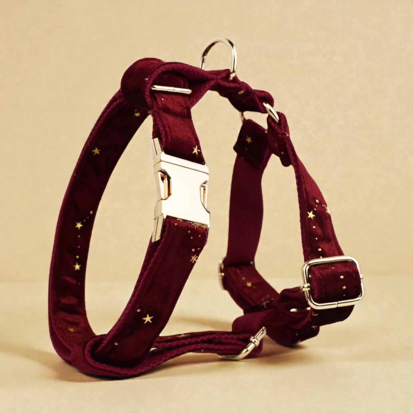 Red dog harness with star patterns on a beige background