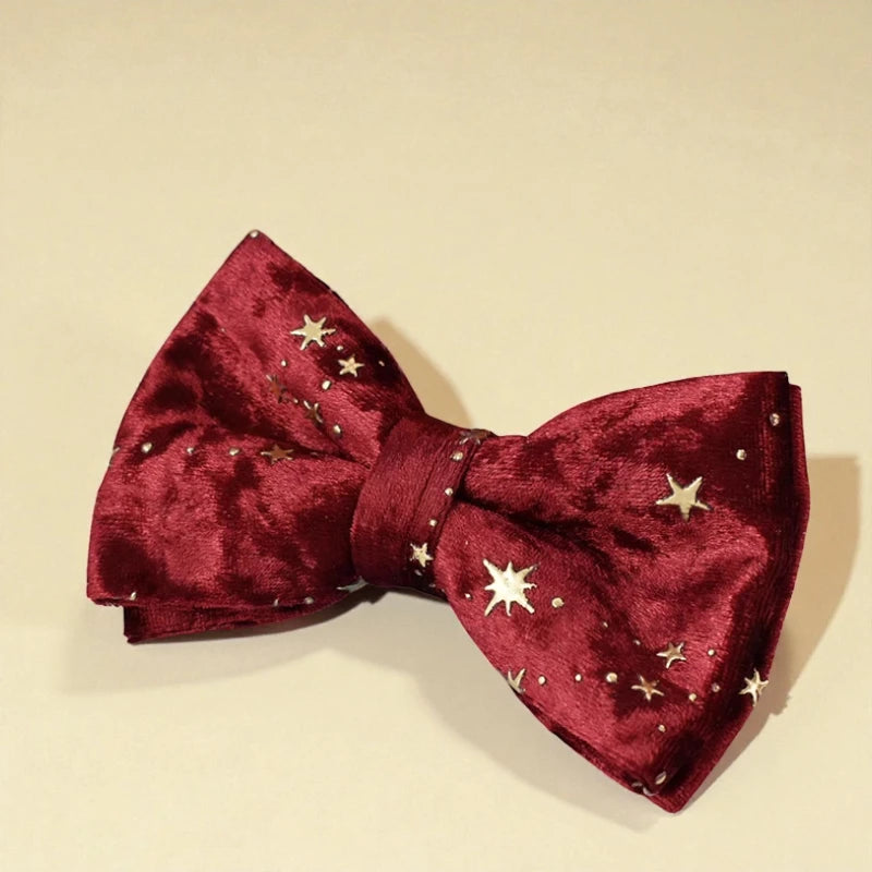 Red bow tie with star patterns on a beige background