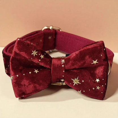 Red velvet bow tie with gold stars on a beige background