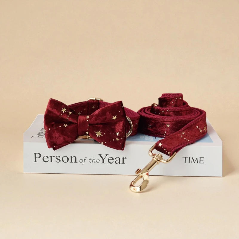 Red dog bow tie and leash set on a book with 'Person of the Year' and 'TIME' text.
