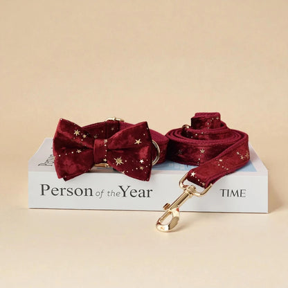 Red dog bow tie and leash set on a book with 'Person of the Year' and 'TIME' text.