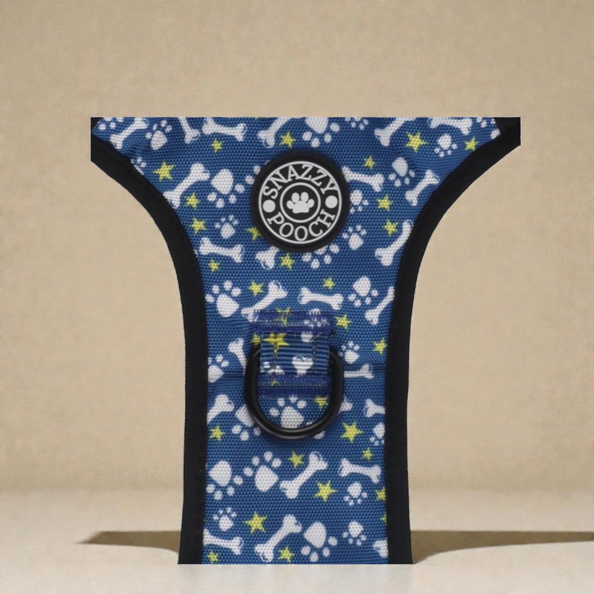 Dog harness with blue pattern featuring bones and stars on a beige background