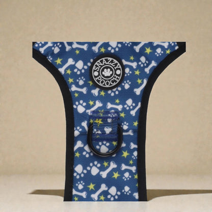 Dog harness with blue pattern featuring bones and stars on a beige background