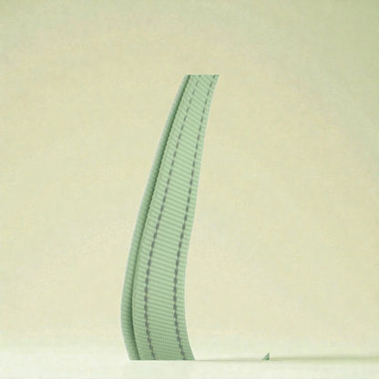 Green material on dog harness on a beige background