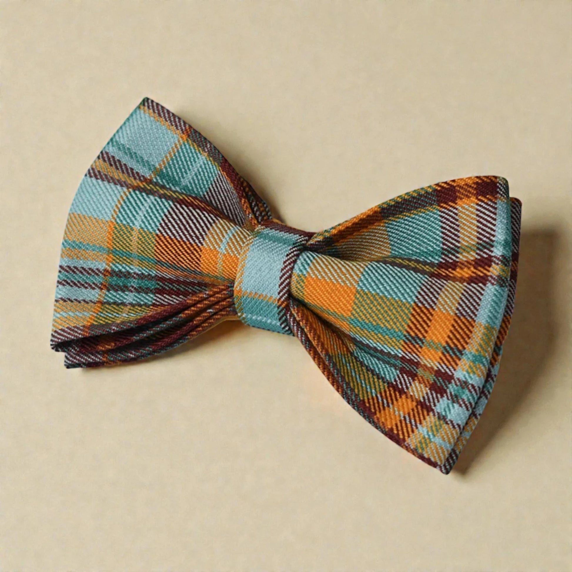 Plaid bow tie on a beige background