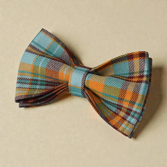 Plaid bow tie on a beige background