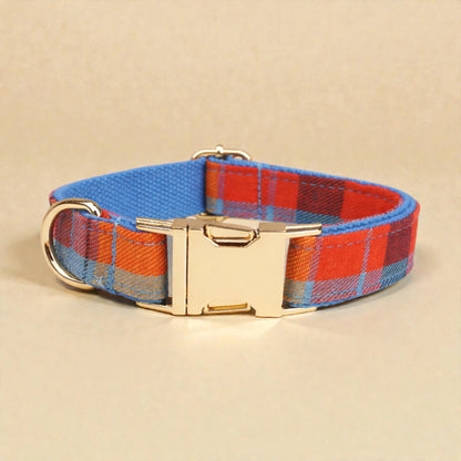 Plaid blue dog collar with gold buckle on a beige background