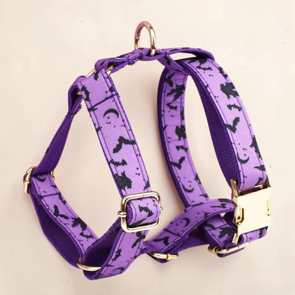 Purple personalised Halloween dog harness with bats crescent moons and stars