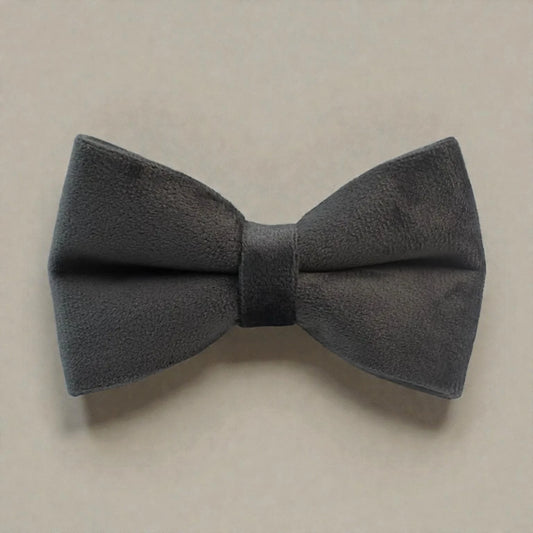 Grey bow tie on a beige background