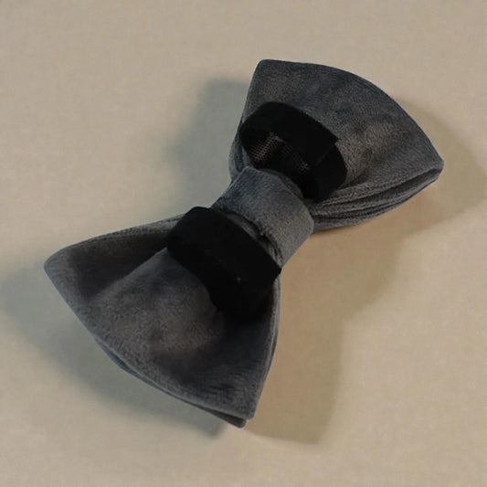 Grey bow tie on a beige background