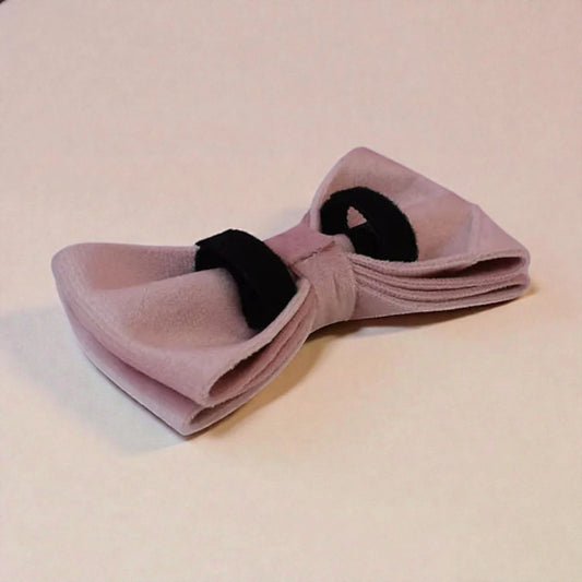 Pink bow on a beige background