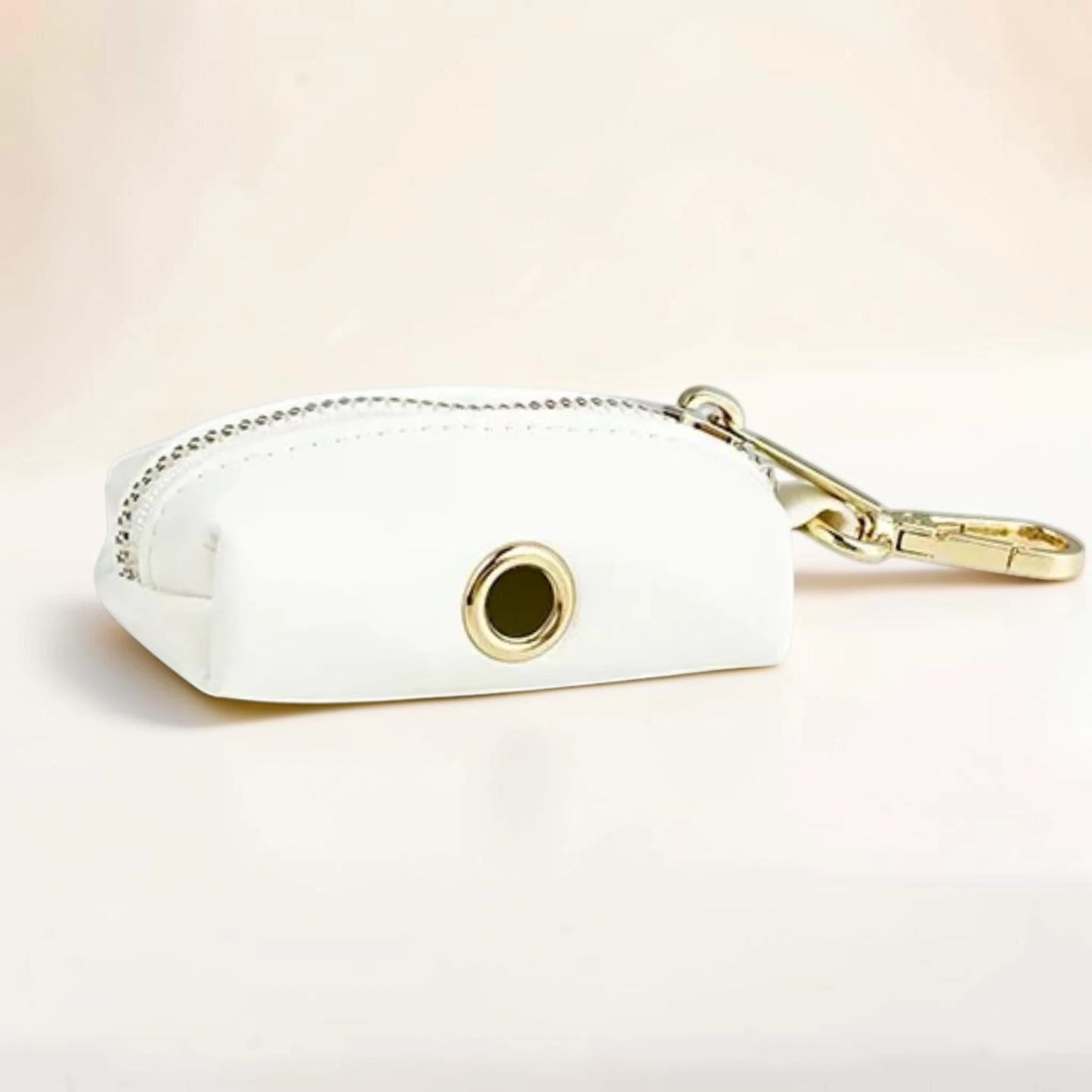 White leather effect dog poop bag holder with gold clip and zip